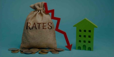 A burlap bag with Rates written on it next to a red arrow pointing down and a green Scottsdale home for sale